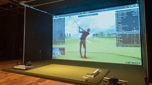 Master Your Swing Indoors: How to Use Golf Simulators and Training Aids to Improve Your Game